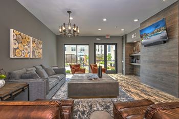 a living room with couches and a coffee table  at Watermark on Twenty Mile, Parker, 80134